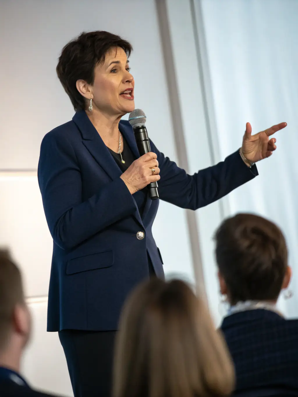 A dynamic shot of a keynote speaker passionately addressing a large audience at a past WaveEngine tech conference in London, emphasizing the energy and engagement of the event.